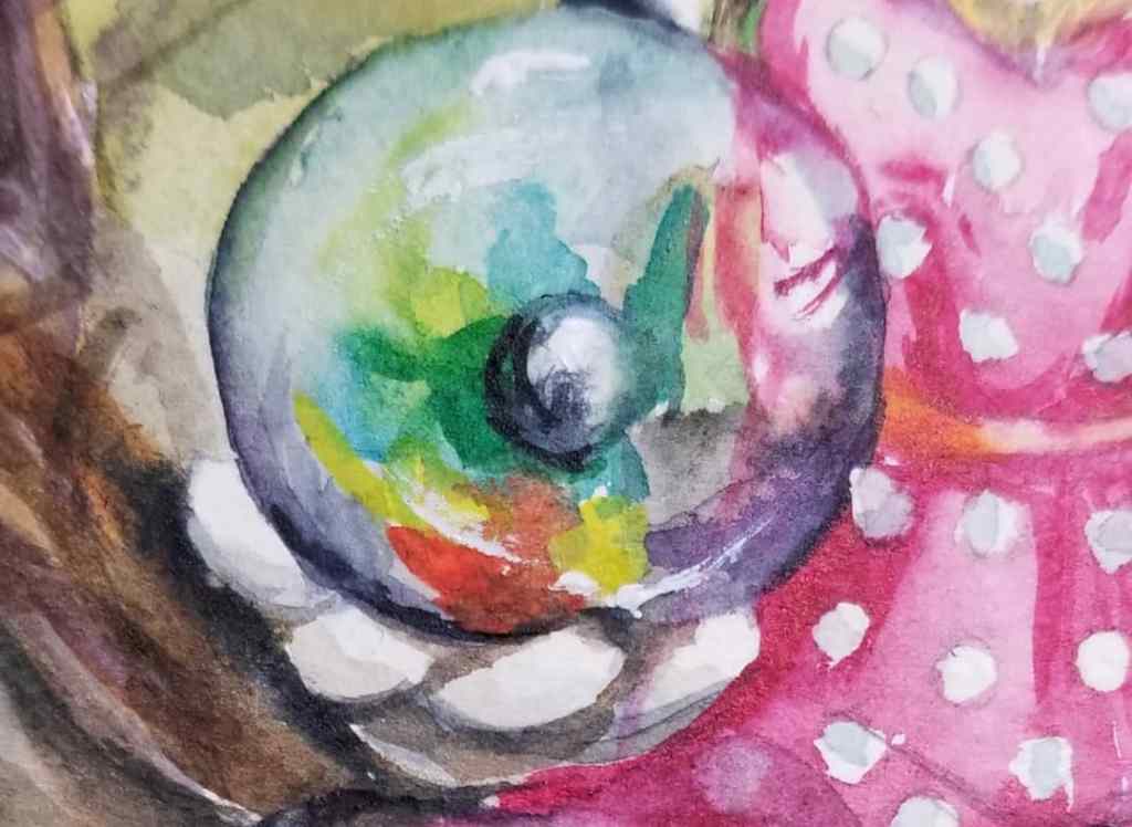 Rabbit hand holding a crystal ball or a marble.